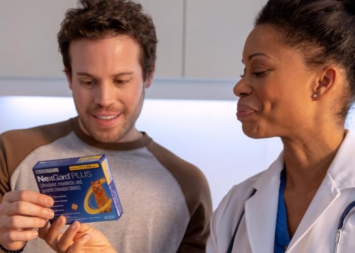 A vet gives her client NexGard Plus